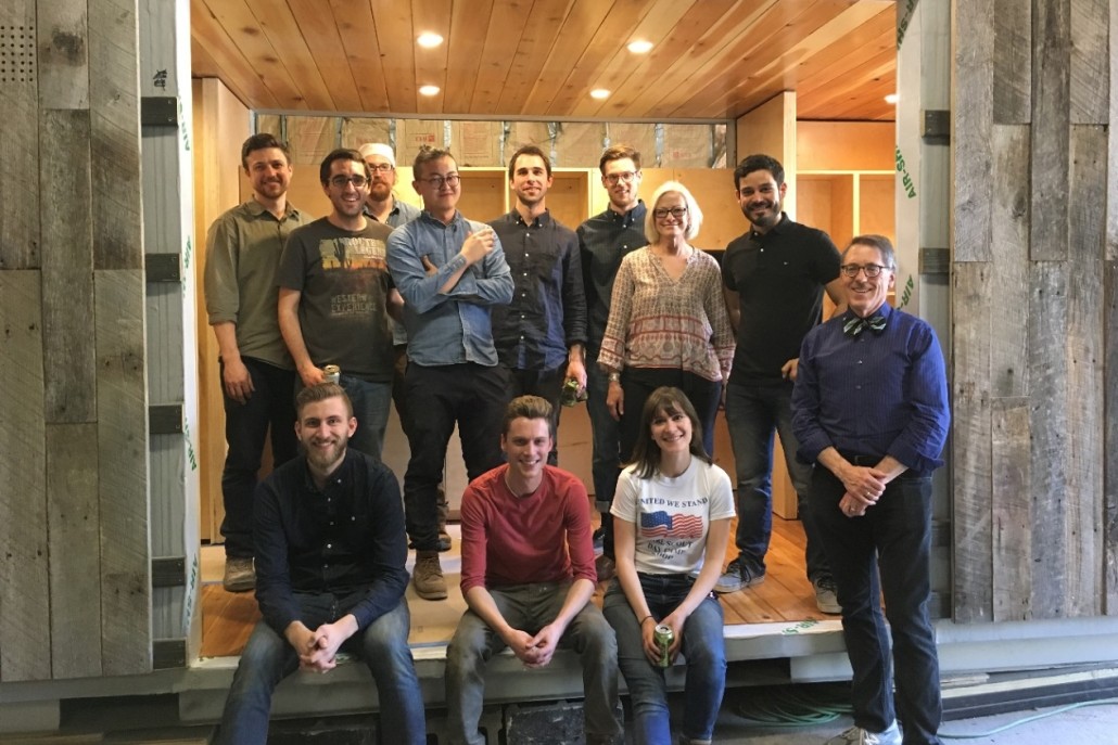 Students from the spring 2016 semester gather with Cassel and professors in the under-construction house. Left to right (front row): DAAP graduate students Jon Lund, Alex Gormley, Marissa Zane and structures professor Tom Bible. Left to right (back row): DAAP graduate students Tom Covert, Narek Mirzaei, studio professor Whitney Hamaker, Guande Wu, Alex Bucher, Dylan Holte, land steward Adrienne Cassel and Luis Sabater Musa. 